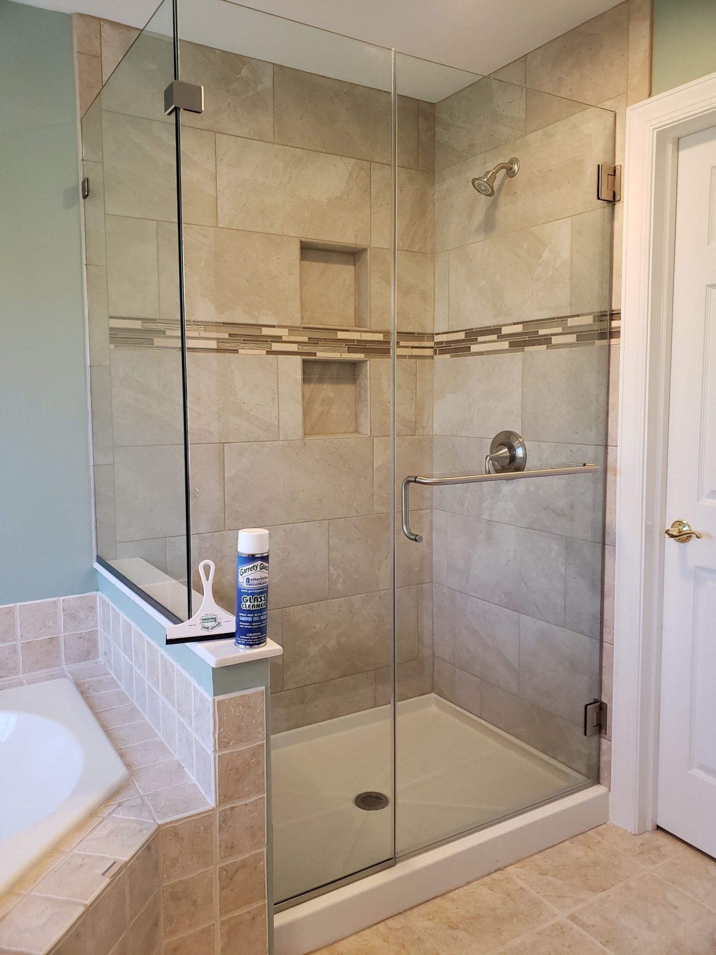 Shower with frameless glass walls and doors