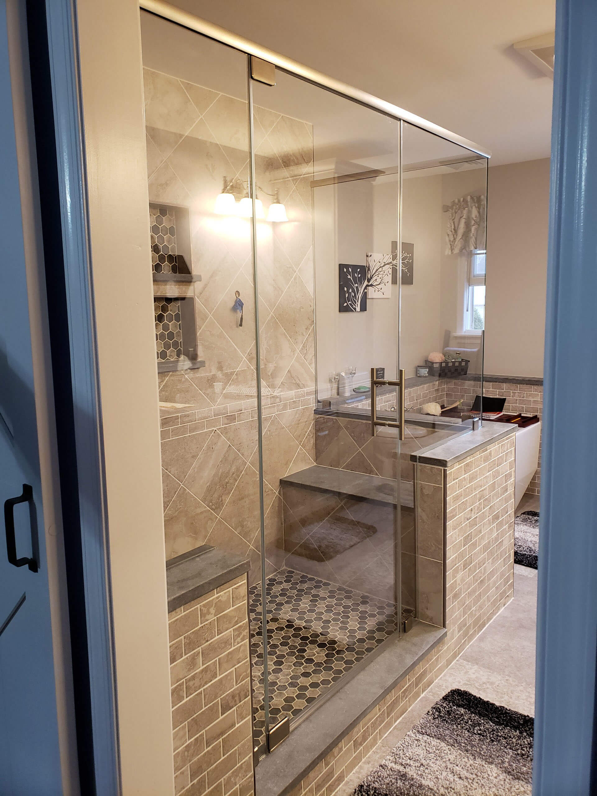 A beautiful new shower with large glass walls and door